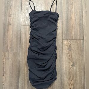 Babaton Aritzia Ruched Bodycon Mini Dress XS Black — Sleek Stretchy Silhouette
